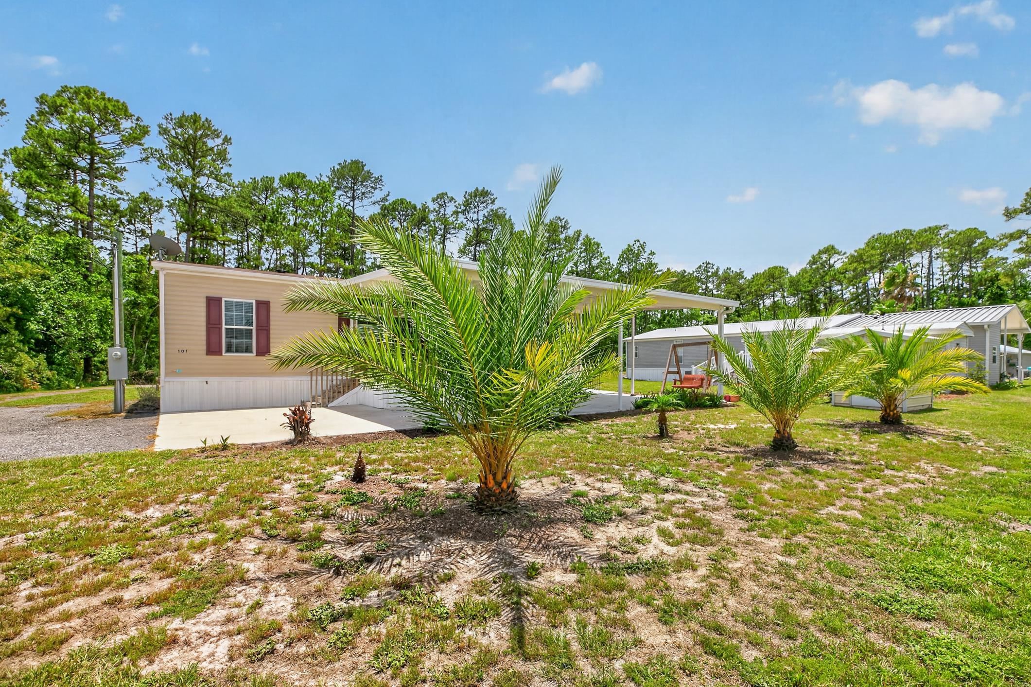 101 Trout Trail Crescent City, FL 32112 - Photo 1 of 45 a house with river in front of it