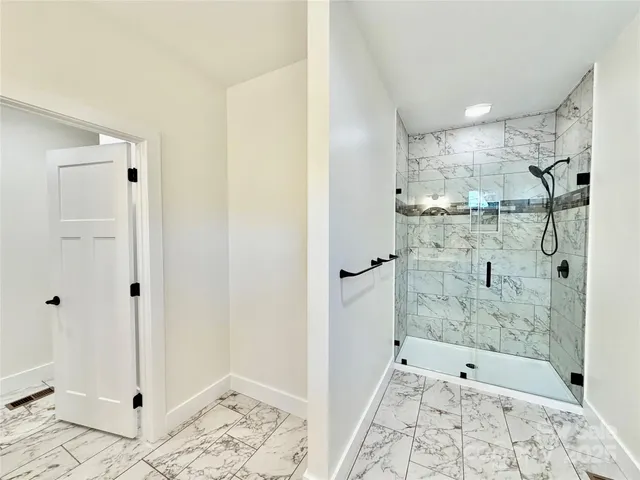 a bathroom with a shower and a sink