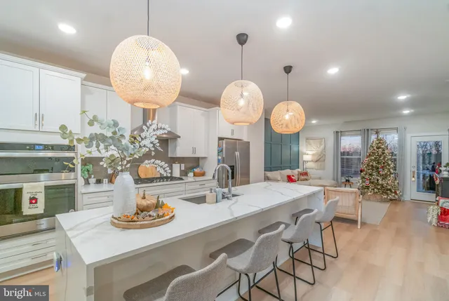 a kitchen with a table and chairs in it