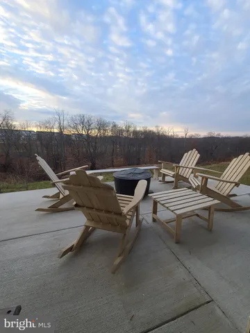 a view of a terrace with sitting area