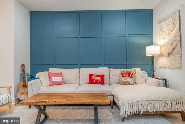 a bedroom with a bed and a night stand