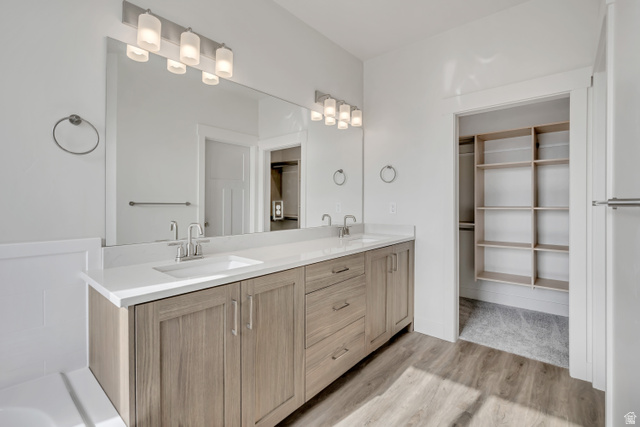 3839 West 825 North, Unit WF18 West Point, UT 84015 - Photo 13 of 22 Bathroom featuring a walk in closet, double vanity, and light wood finished floors