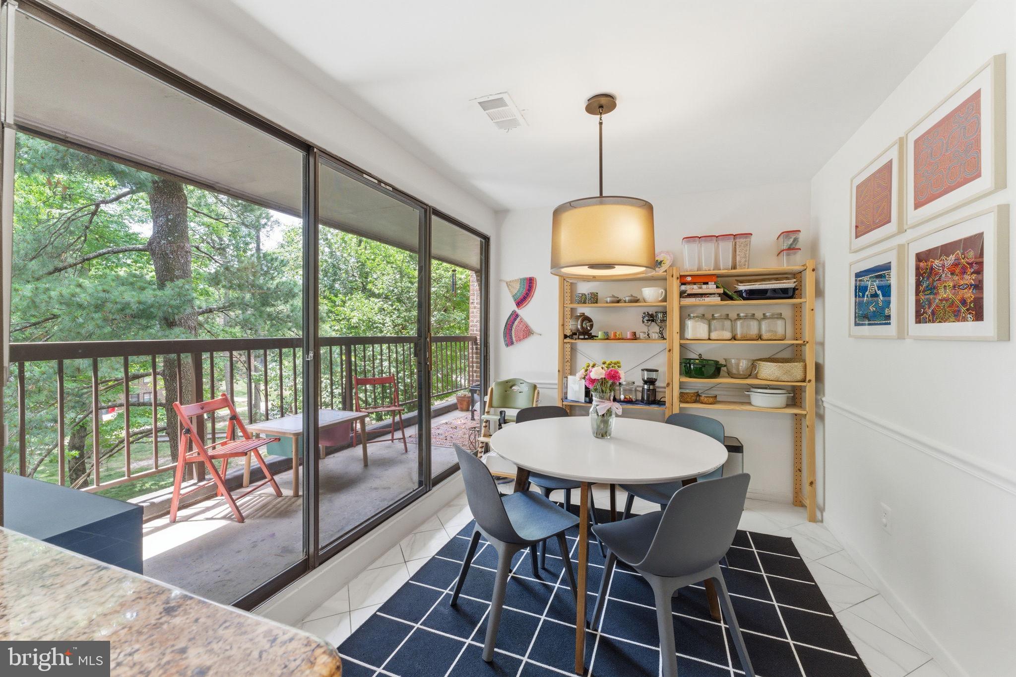 11260 Chestnut Grove Square, Unit 337 Reston, VA 20190 - Photo 24 of 82 Bright dining space with nature views.