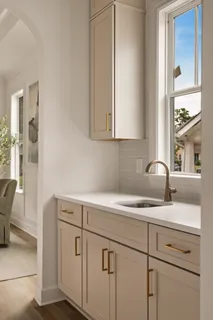 a bathroom with a bathtub and a window