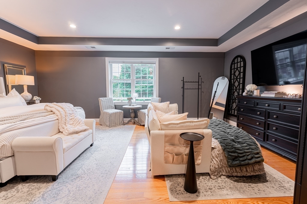38 Cherry Street, Unit B Hudson, MA 01749 - Photo 20 of 33 a living room with furniture a flat screen tv and a fireplace