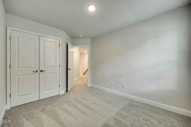 a bathroom with a double vanity sink a mirror and shower