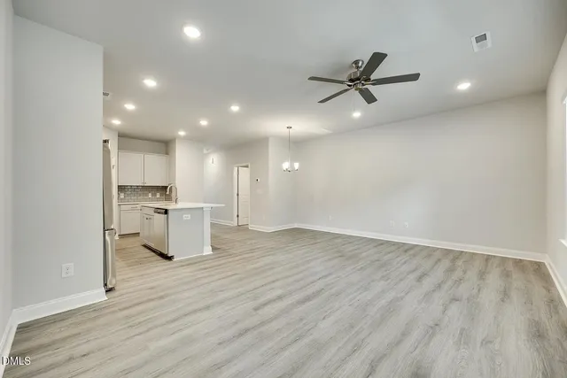 a kitchen with stainless steel appliances a refrigerator stove microwave and cabinets