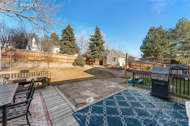 a view of a backyard with sitting area