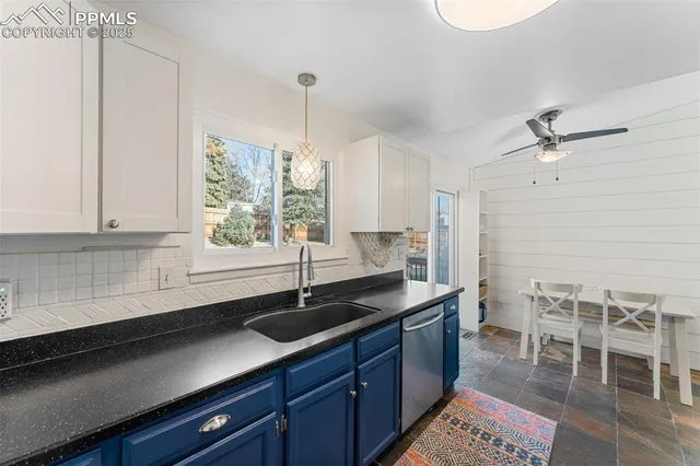 a kitchen with a sink and cabinets