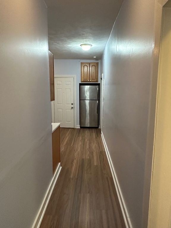347 Summer Street, Unit 2 Lynn, MA 01905 - Photo 11 of 14 a view of a hallway with wooden floor