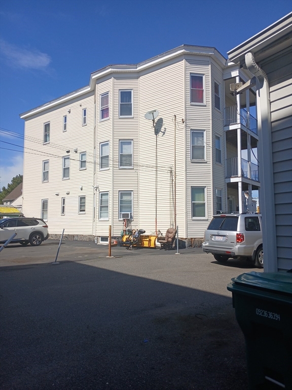 347 Summer Street, Unit 2 Lynn, MA 01905 - Photo 2 of 14 a cars parked in front of a building