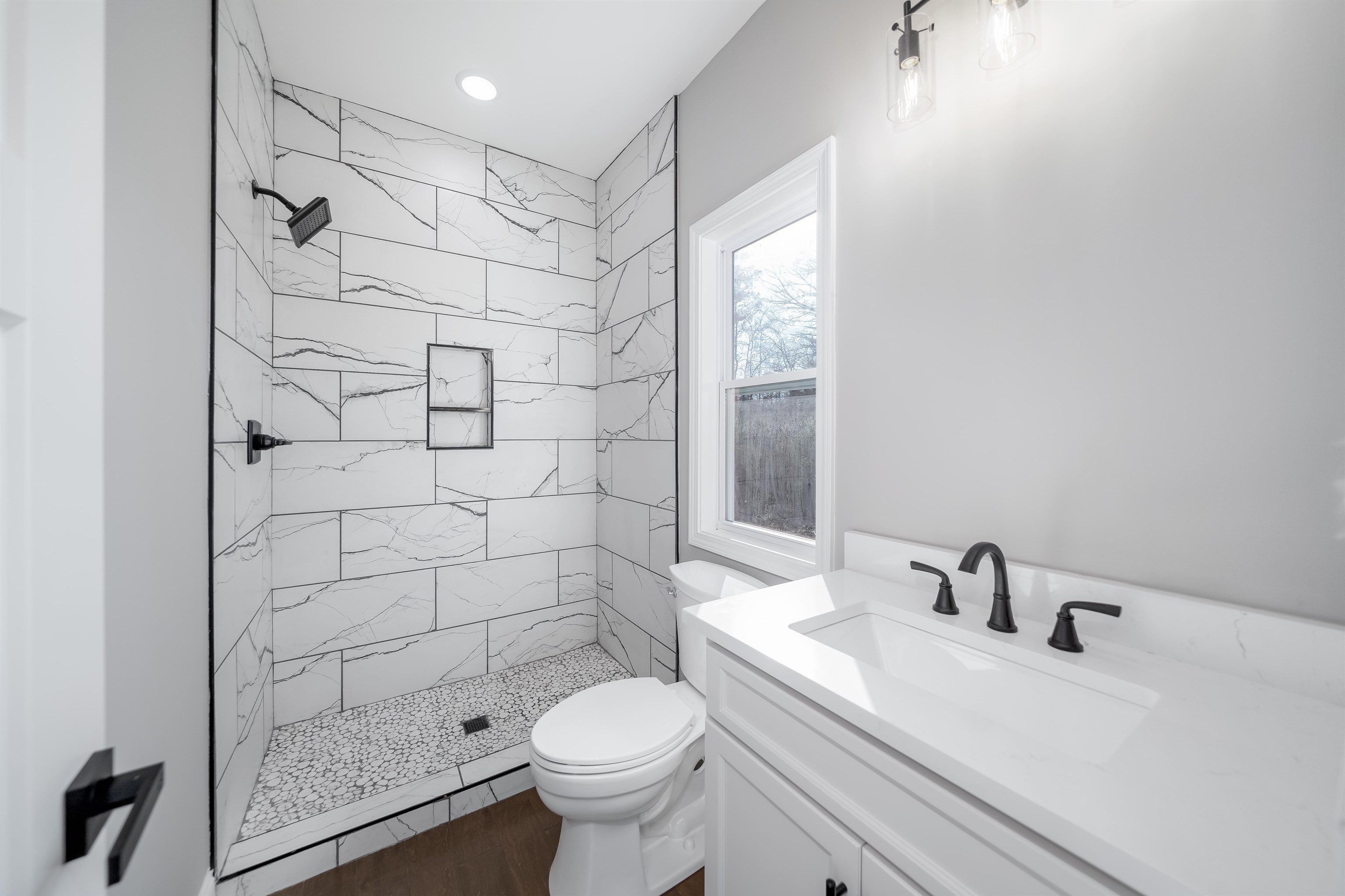 50 Deer Path Road Adamsville, TN 38310 - Photo 11 of 23 a bathroom with a sink toilet and shower