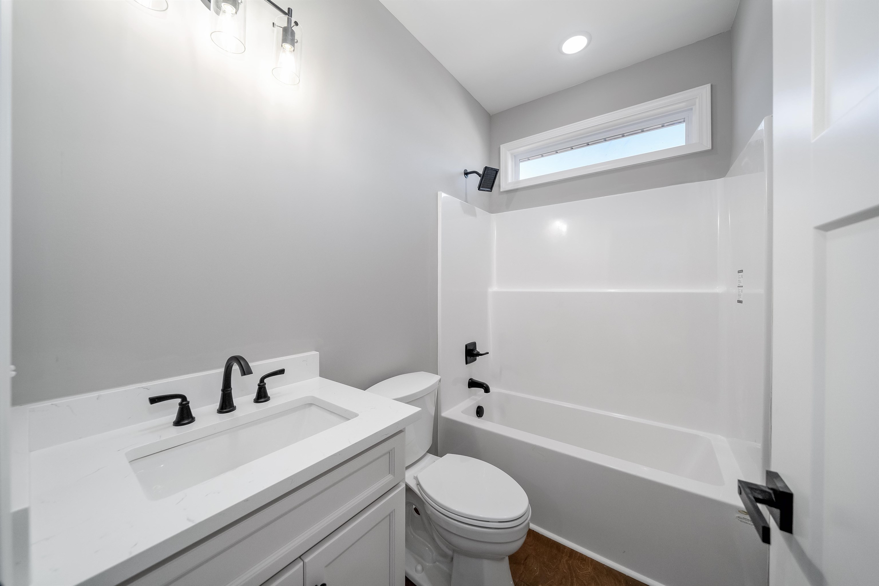 50 Deer Path Road Adamsville, TN 38310 - Photo 18 of 23 a white toilet sitting next to a bathroom sink