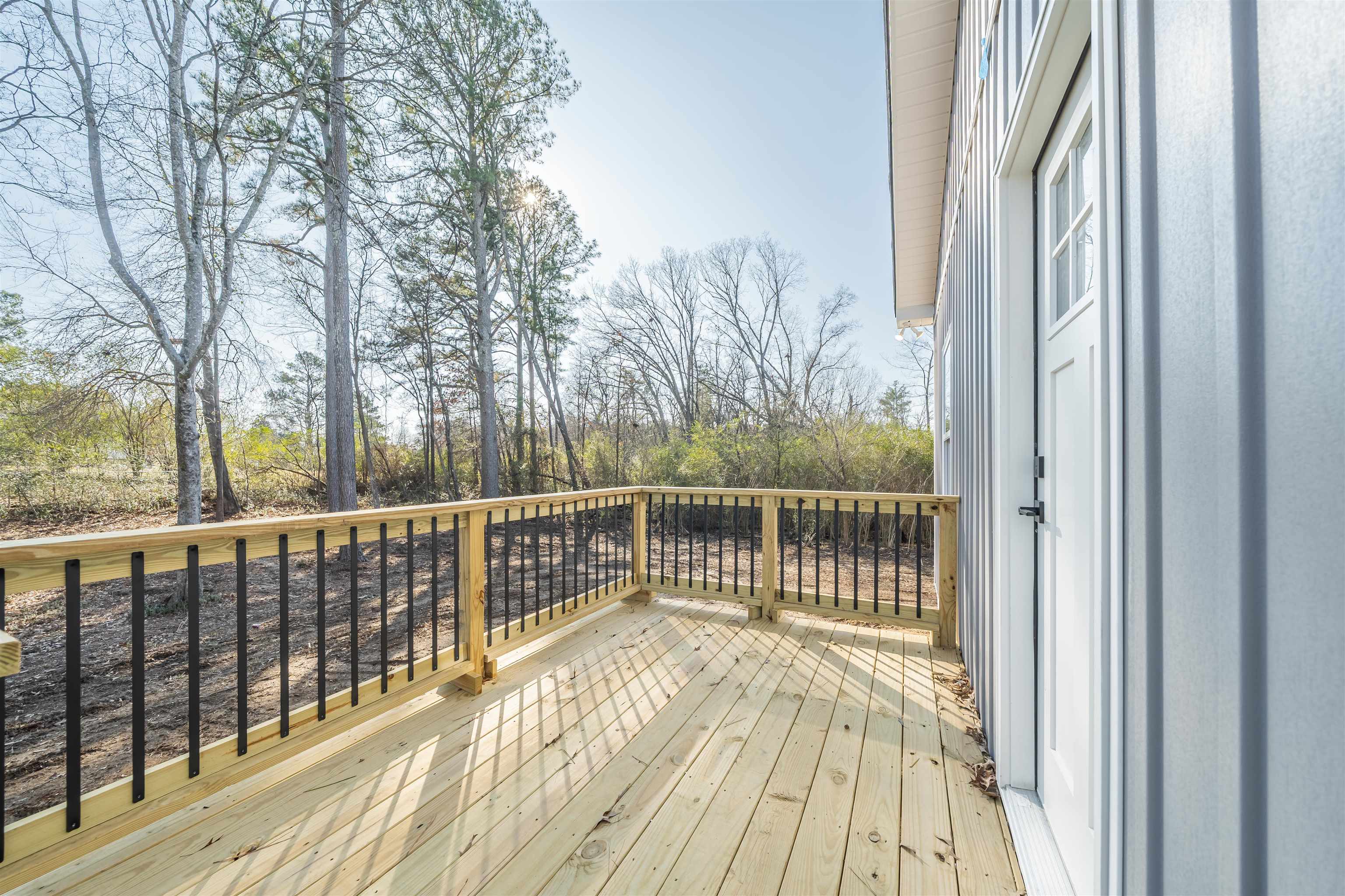 50 Deer Path Road Adamsville, TN 38310 - Photo 20 of 23 a view of a balcony with wooden floor and fence
