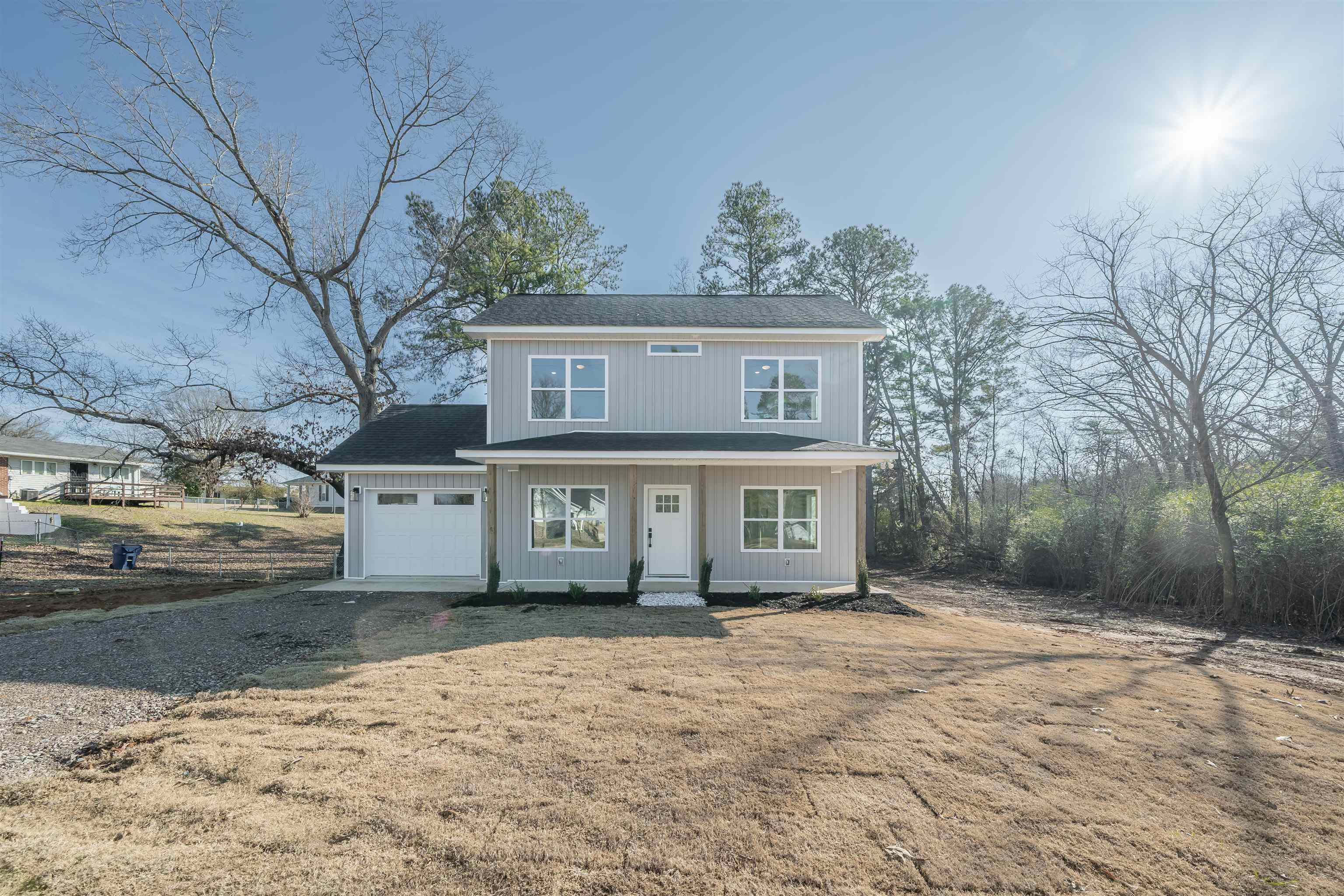 50 Deer Path Road Adamsville, TN 38310 - Photo 21 of 23 front view of a house with a yard