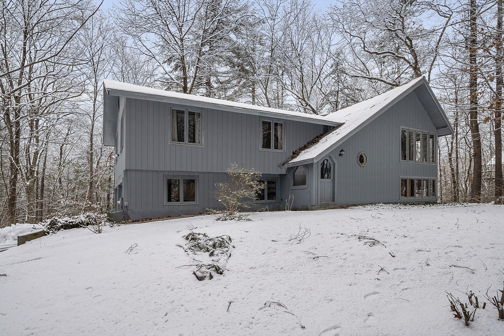 117 Waite Road Boxborough, MA 01719 - Photo 1 of 37 a view of house with a yard covered with snow in front of house