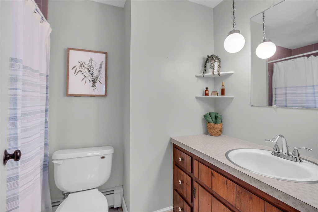117 Waite Road Boxborough, MA 01719 - Photo 20 of 37 a bathroom with a toilet a sink and a mirror