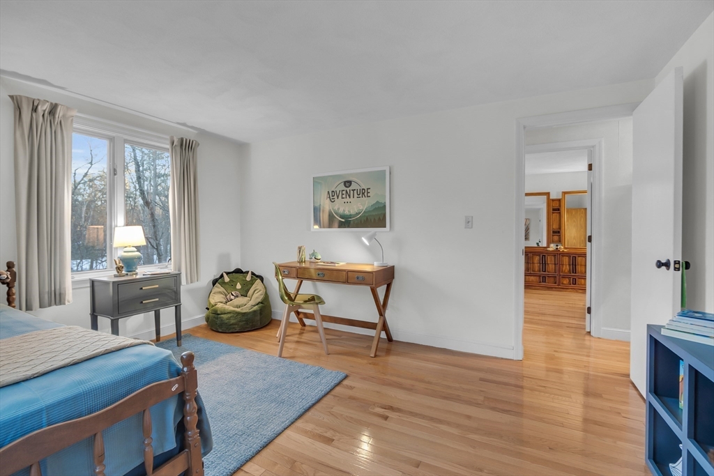 117 Waite Road Boxborough, MA 01719 - Photo 24 of 37 a living room with furniture and a wooden floor