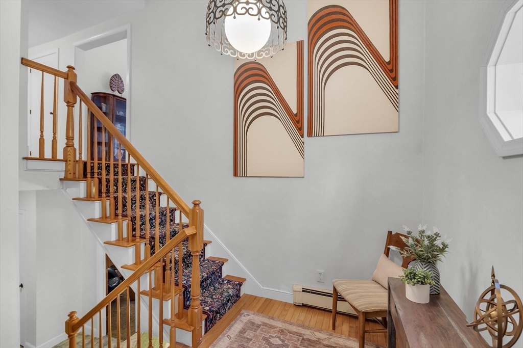 117 Waite Road Boxborough, MA 01719 - Photo 3 of 37 a view of entryway with wooden floor and a rug