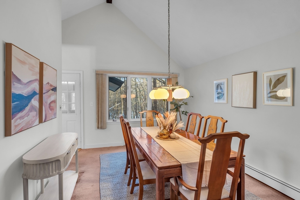 117 Waite Road Boxborough, MA 01719 - Photo 8 of 37 a view of a dining room with furniture a chandelier and wooden floor