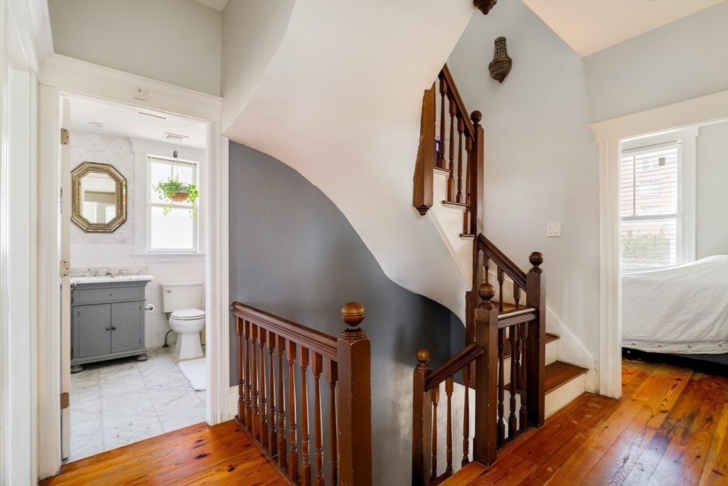 70 Oxford Street Somerville, MA 02143 - Photo 19 of 38 a view of entryway and hall with wooden floor