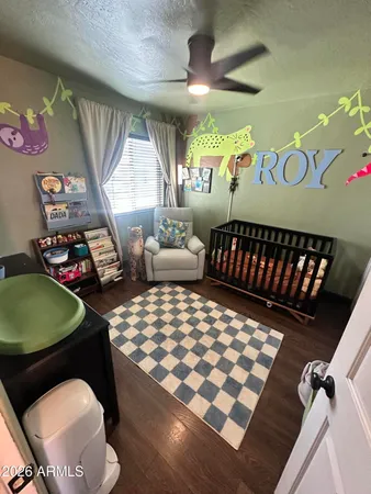 a bedroom with furniture window and a rug