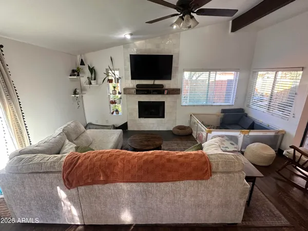 a living room with furniture and a flat screen tv