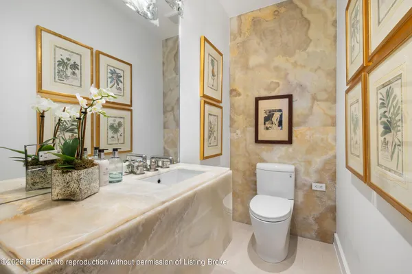 a kitchen with a sink and stainless steel appliances