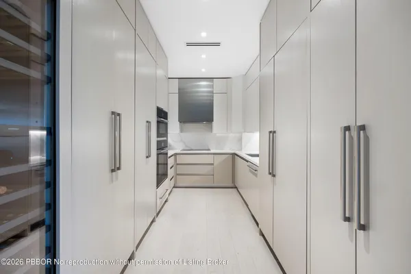 a living room with furniture and potted plant