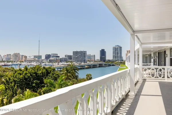 a view of a balcony with wooden floor