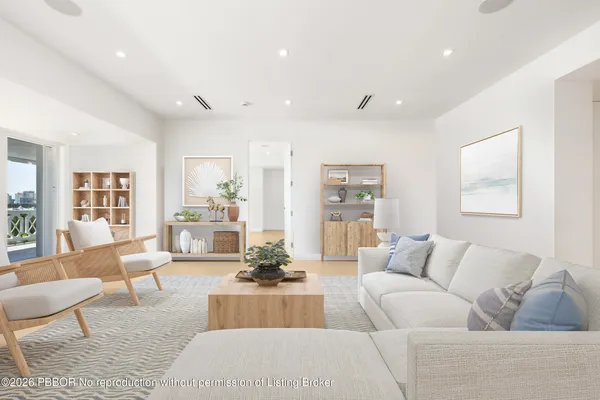 a living room with furniture or couch and a wooden floor