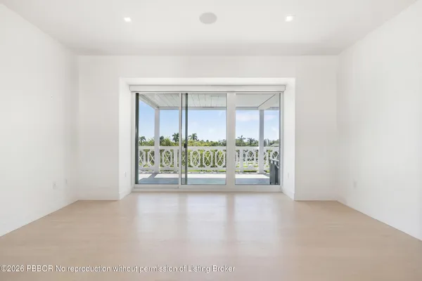 an empty room with large window