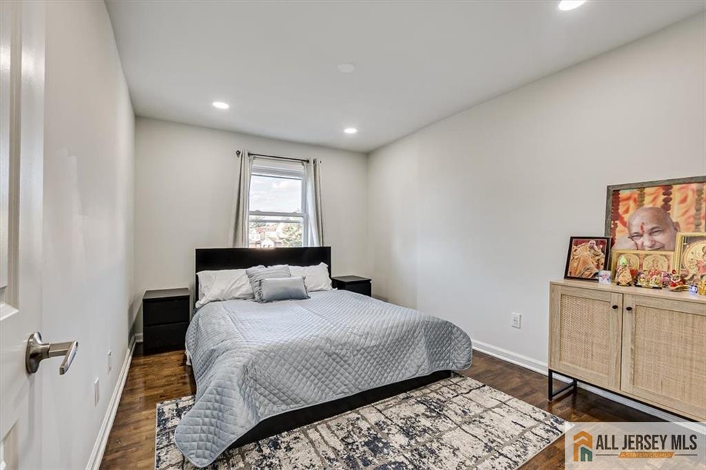 3003 Hana Road Edison, NJ 08817 - Photo 28 of 45 a bedroom with a bed and cabinet