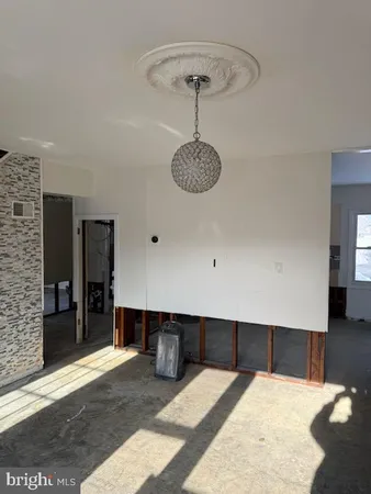 a kitchen with cabinets and window