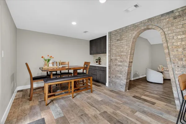 a view of a livingroom with furniture and wooden floor