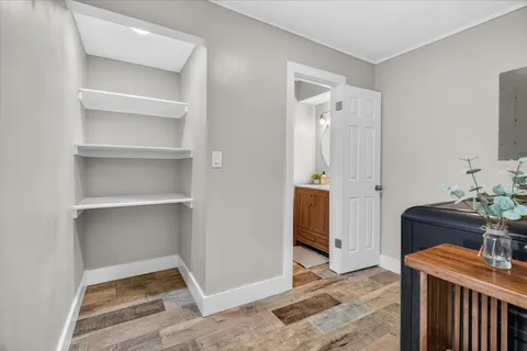 a room that has a dresser in it