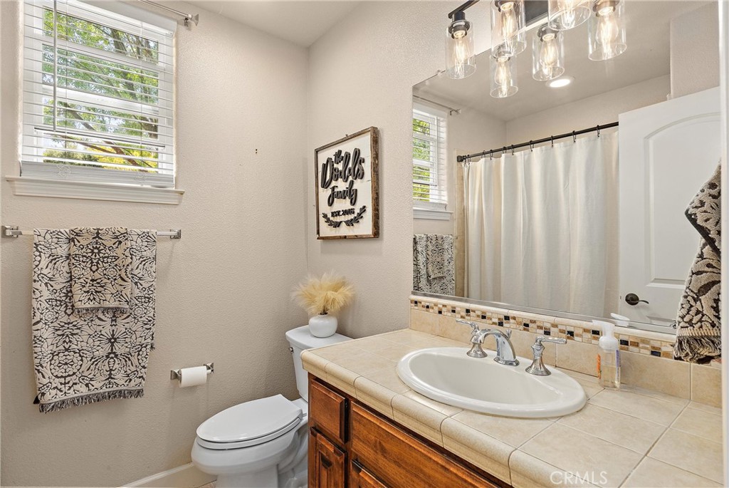 204 Vista Del Rio Court Paso Robles, CA 93446 - Photo 16 of 43 The downstairs bathroom is convenient to the bedroom as well as the family room & kitchen for guests.