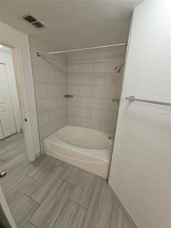 3446 Soho Street, Unit 108 Orlando, FL 32835 - Photo 12 of 39 a bathroom with a shower