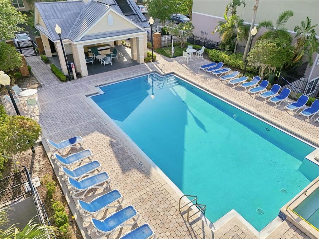 3446 Soho Street, Unit 108 Orlando, FL 32835 - Photo 20 of 39 a view of swimming pool with outdoor seating