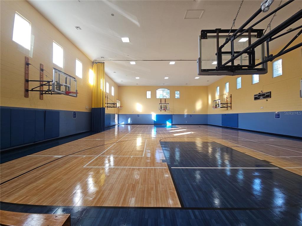 3446 Soho Street, Unit 108 Orlando, FL 32835 - Photo 21 of 39 a view of a room with pool table and chandelier