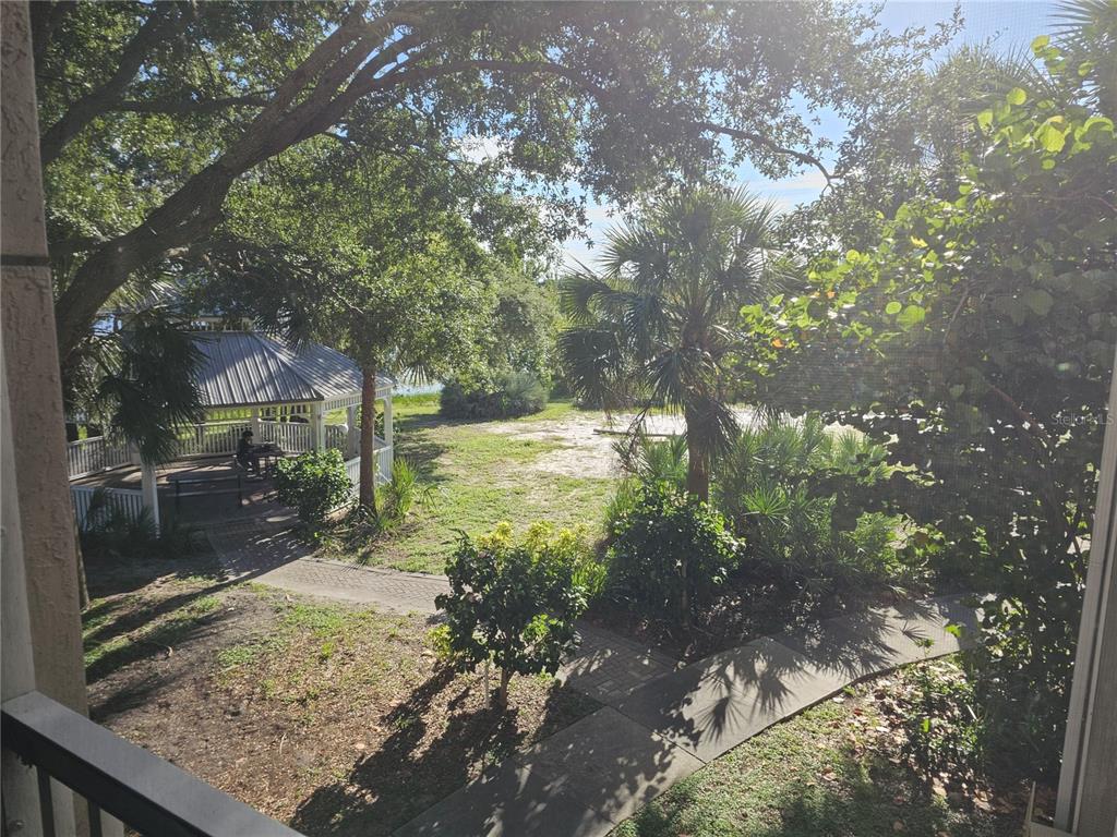 3446 Soho Street, Unit 108 Orlando, FL 32835 - Photo 29 of 39 a view of a yard with a tree