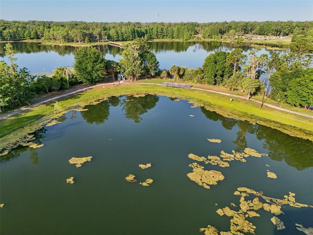 3446 Soho Street, Unit 108 Orlando, FL 32835 - Photo 35 of 39 a view of a lake with a mountain view