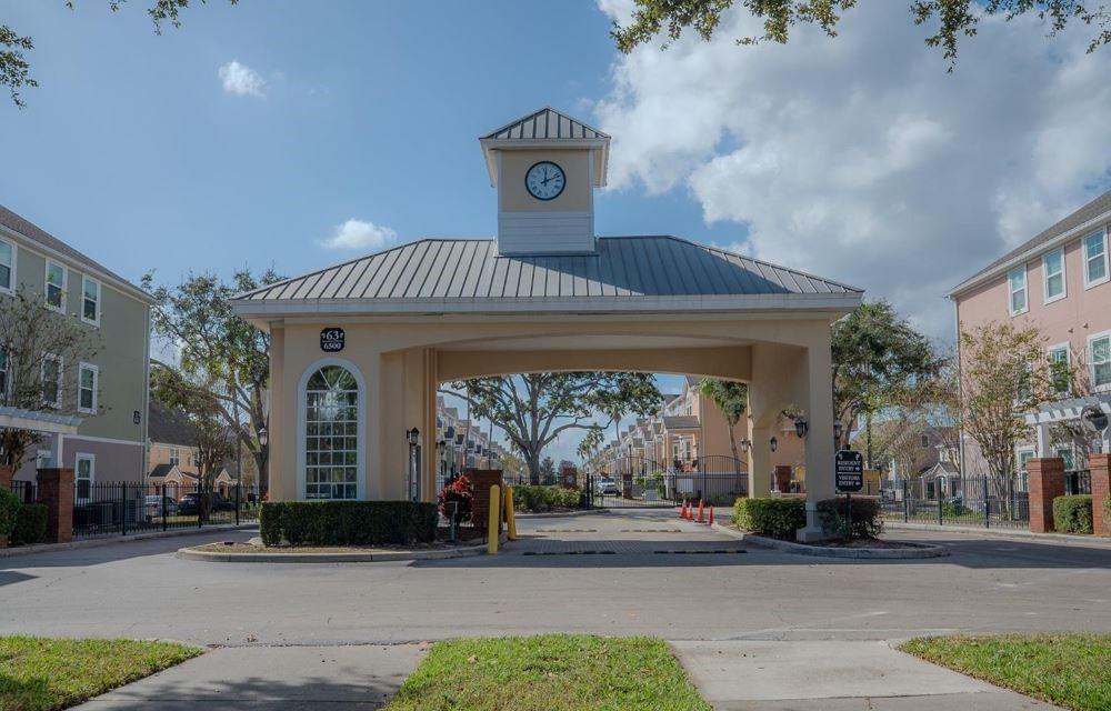 3446 Soho Street, Unit 108 Orlando, FL 32835 - Photo 36 of 39 a front view of a house with a porch