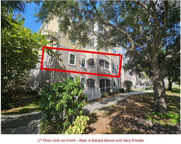 3446 Soho Street, Unit 108 Orlando, FL 32835 - Photo 5 of 39 a view of a house with a yard and potted plants