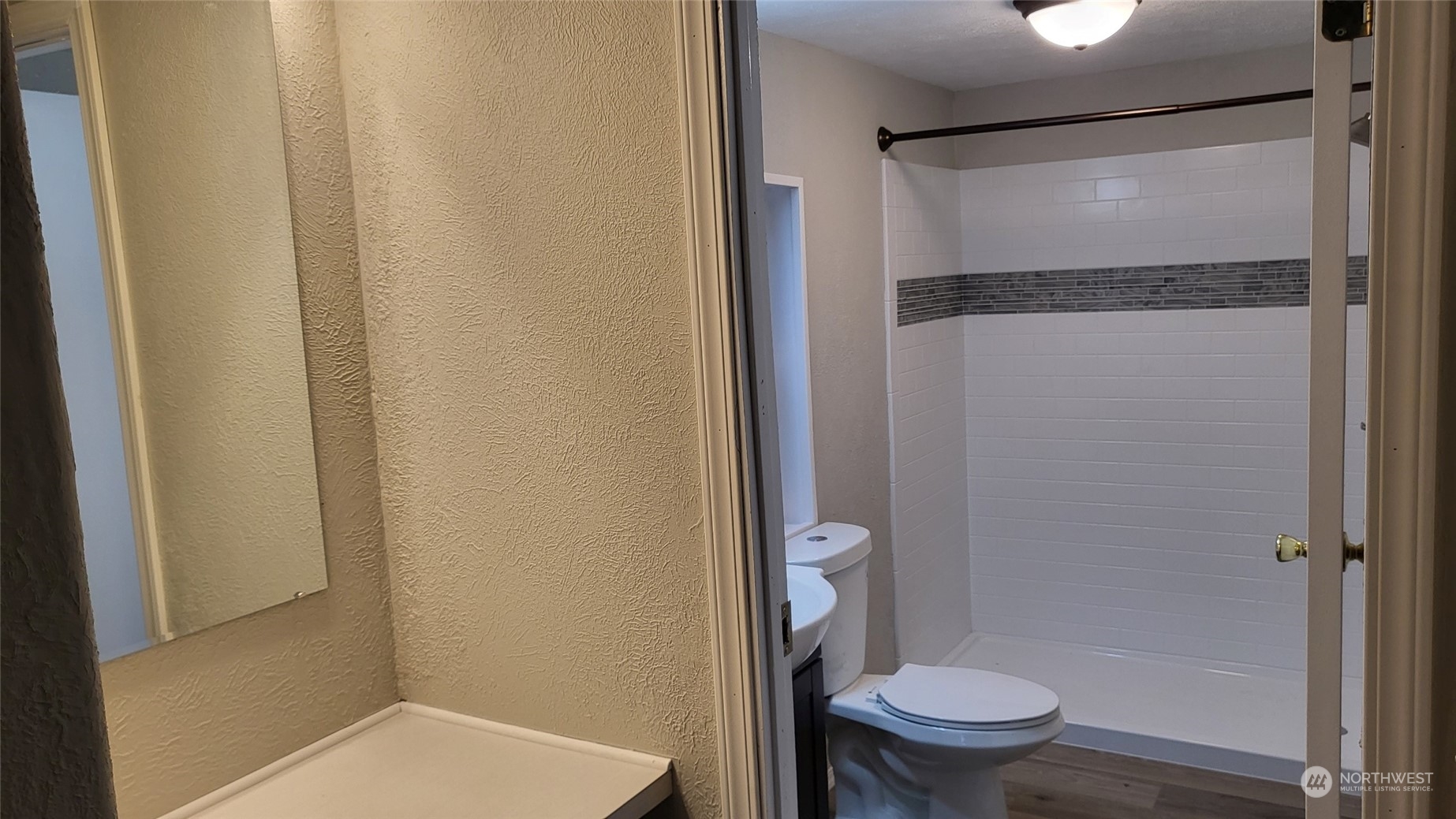 41528 Center Street Concrete, WA 98237 - Photo 14 of 25 a bathroom with a granite countertop toilet and a shower