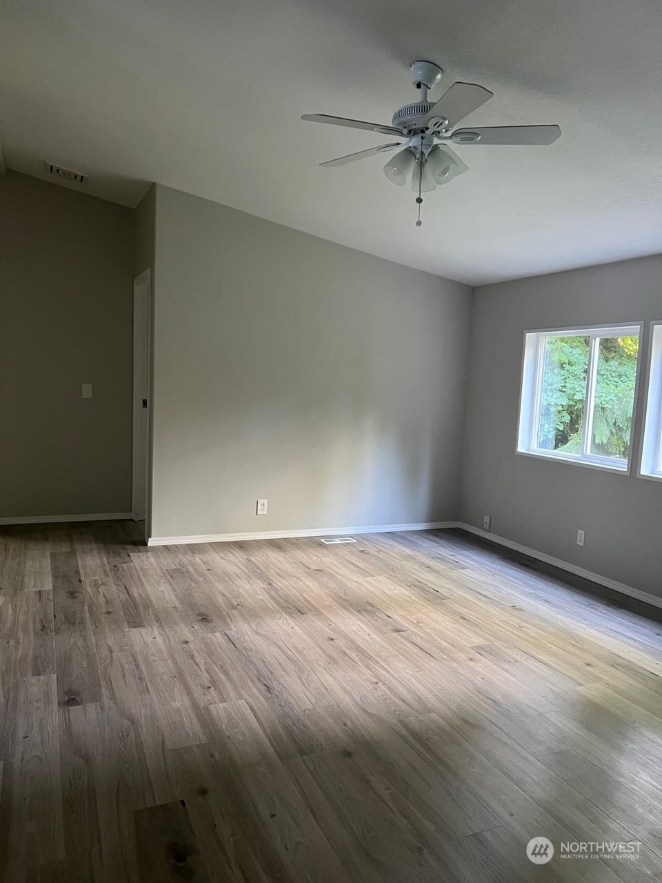 41528 Center Street Concrete, WA 98237 - Photo 10 of 25 an empty room with windows and fan