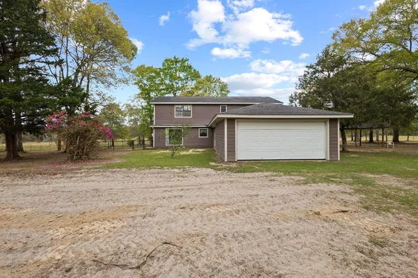 a house with trees in the background