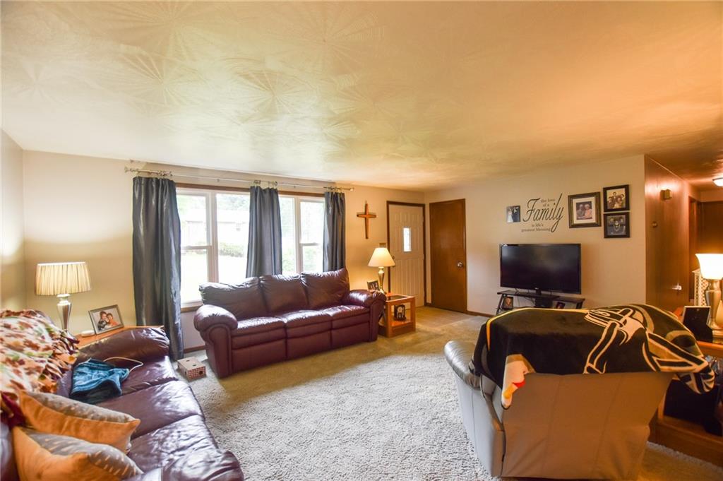 126 Morningside Drive Butler, PA 16002 - Photo 2 of 14 a living room with furniture and a flat screen tv