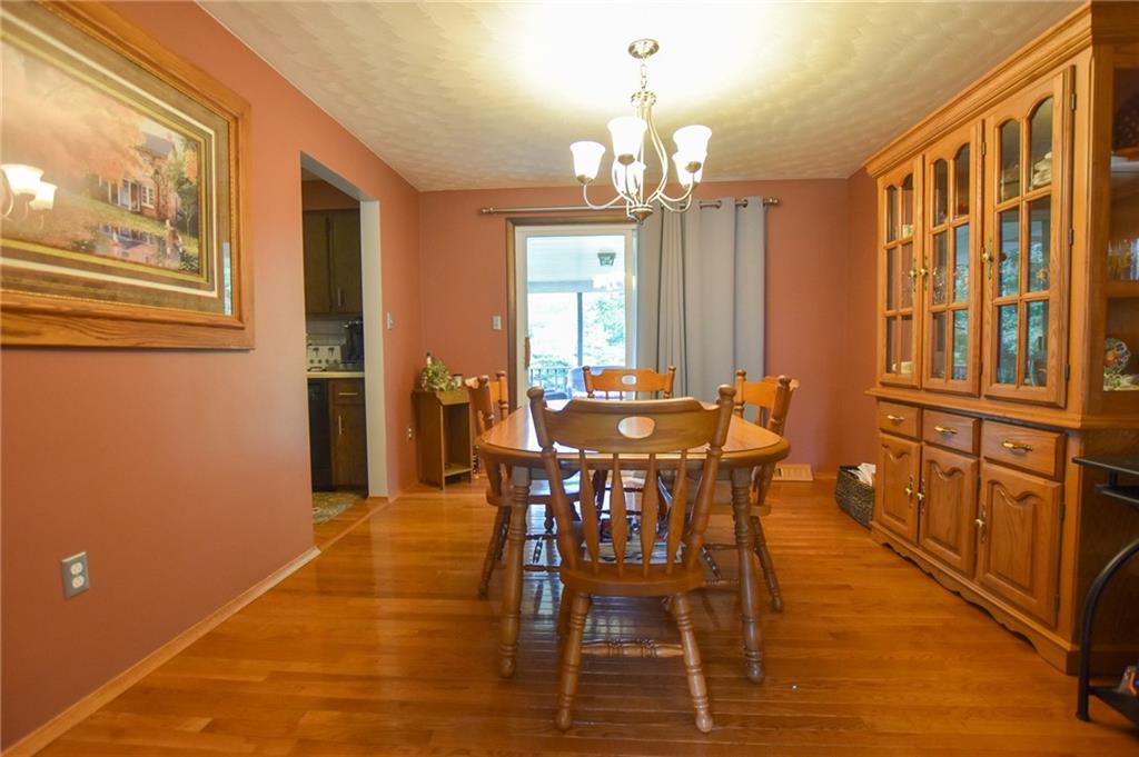 126 Morningside Drive Butler, PA 16002 - Photo 4 of 14 a view of a dining room with furniture and a chandelier
