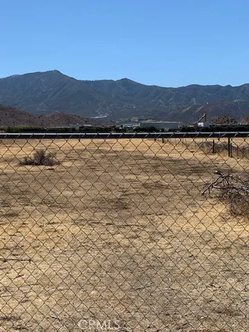 a view of a town with mountains in the background